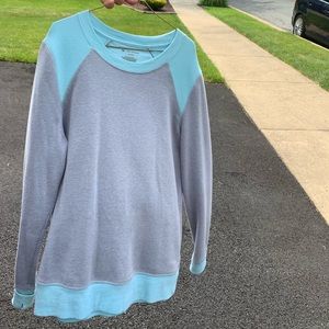 Gray sweatshirt with blue detailing.